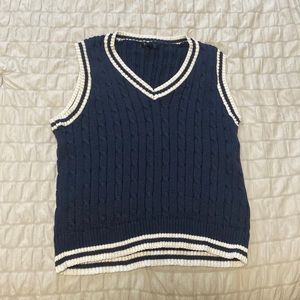 Knitted blue and white v neck vest